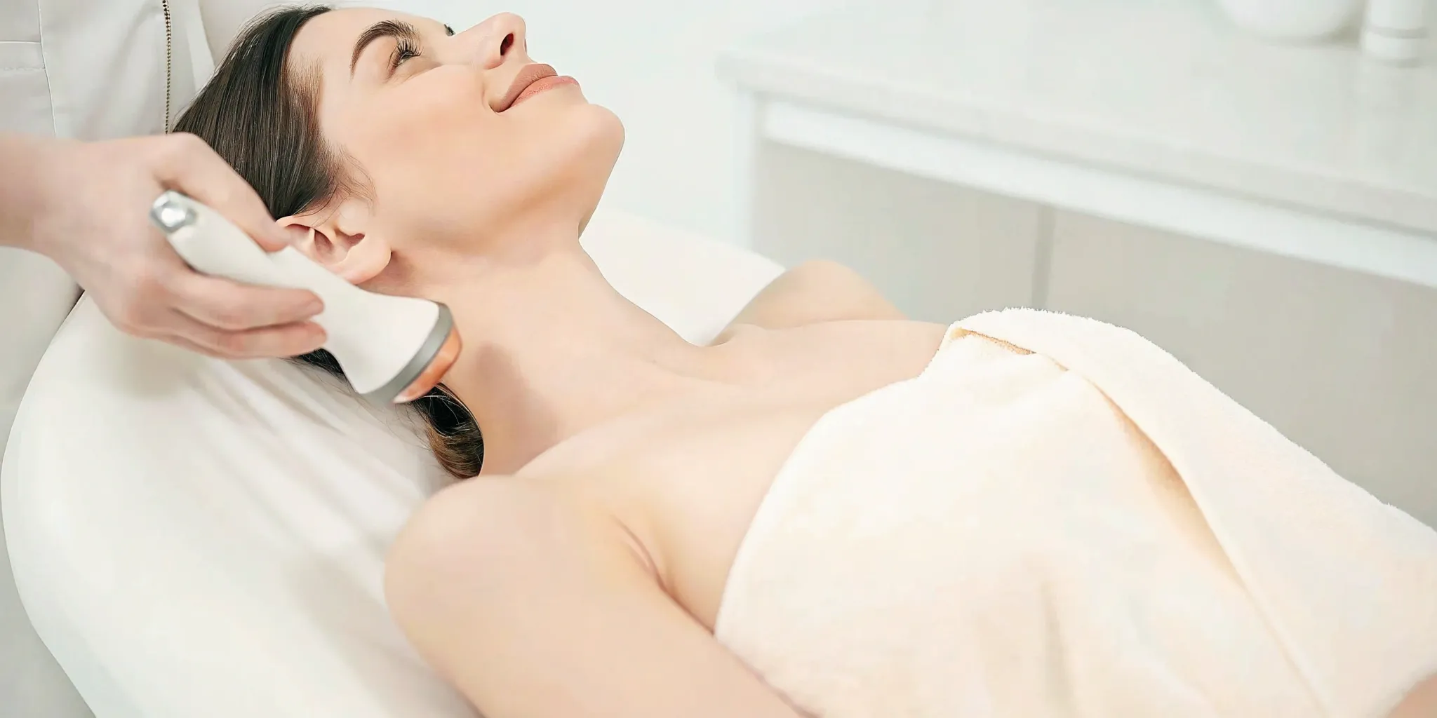 Laser hair removal treatment on a woman's neck.