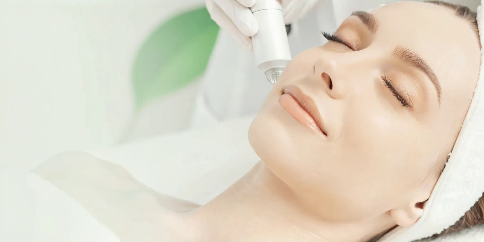 Painless laser hair removal treatment on a woman's face using a modern device with built-in cooling.