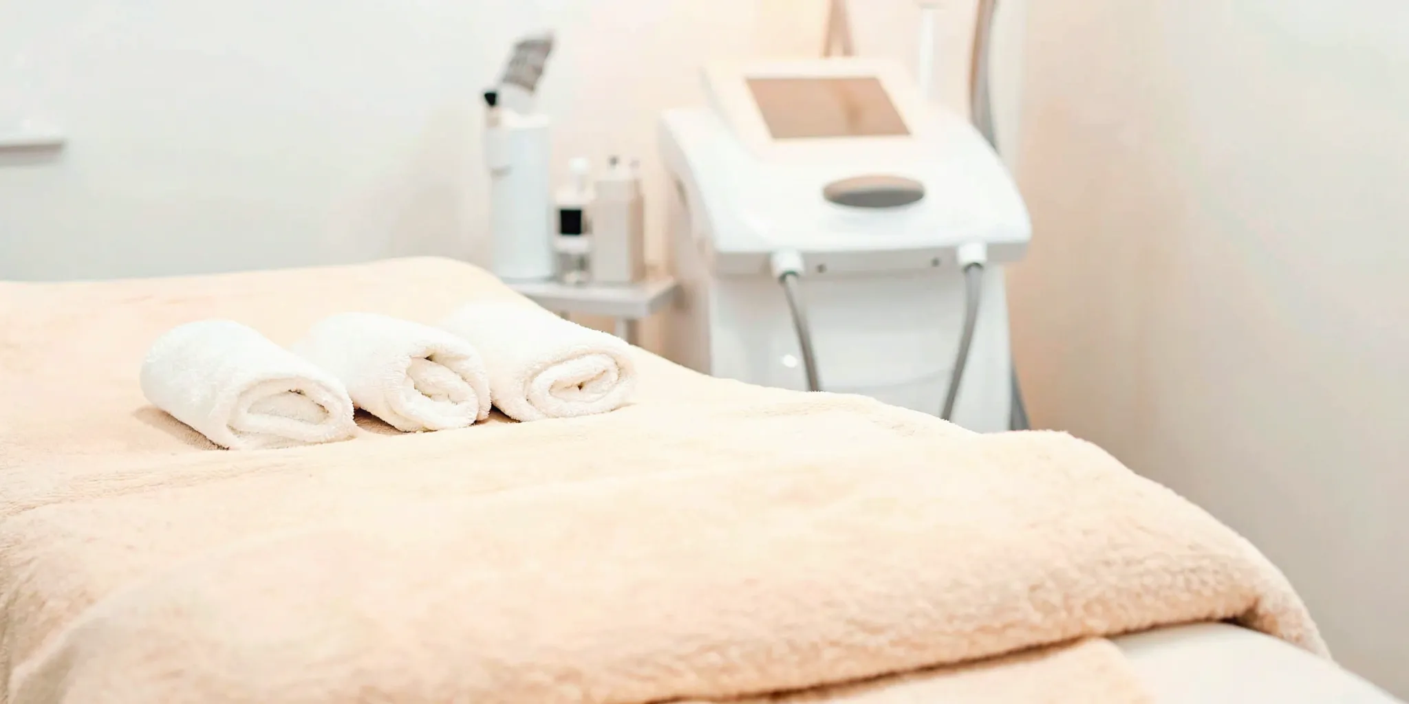A professional treatment room with an UltraShape machine for non-invasive fat reduction.