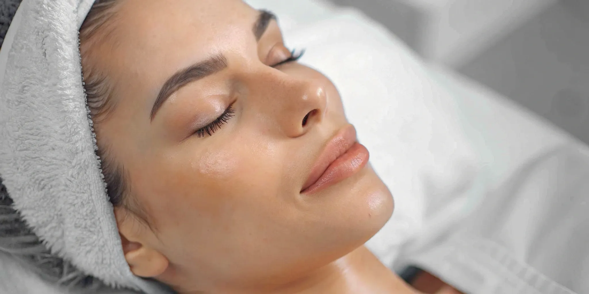 Woman with clear, glowing skin after a VI Peel for dark spots.