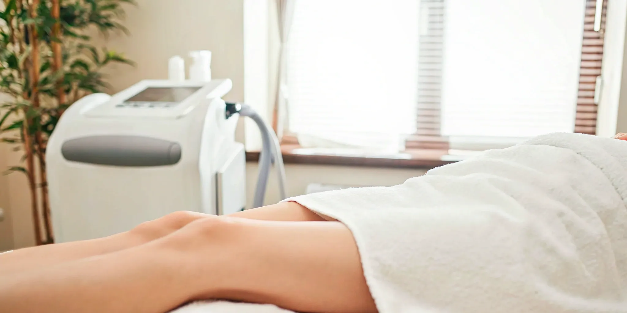 Plano med spa treatment room with advanced equipment.