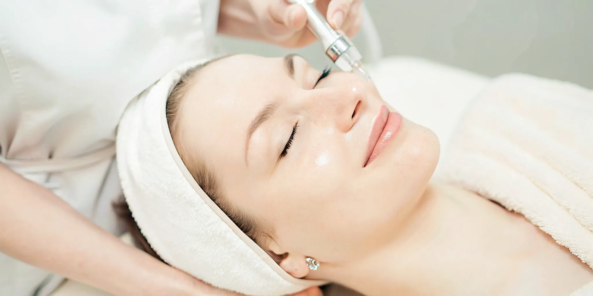 Woman with glowing skin receiving a HydraFacial treatment at a medspa in Frisco.