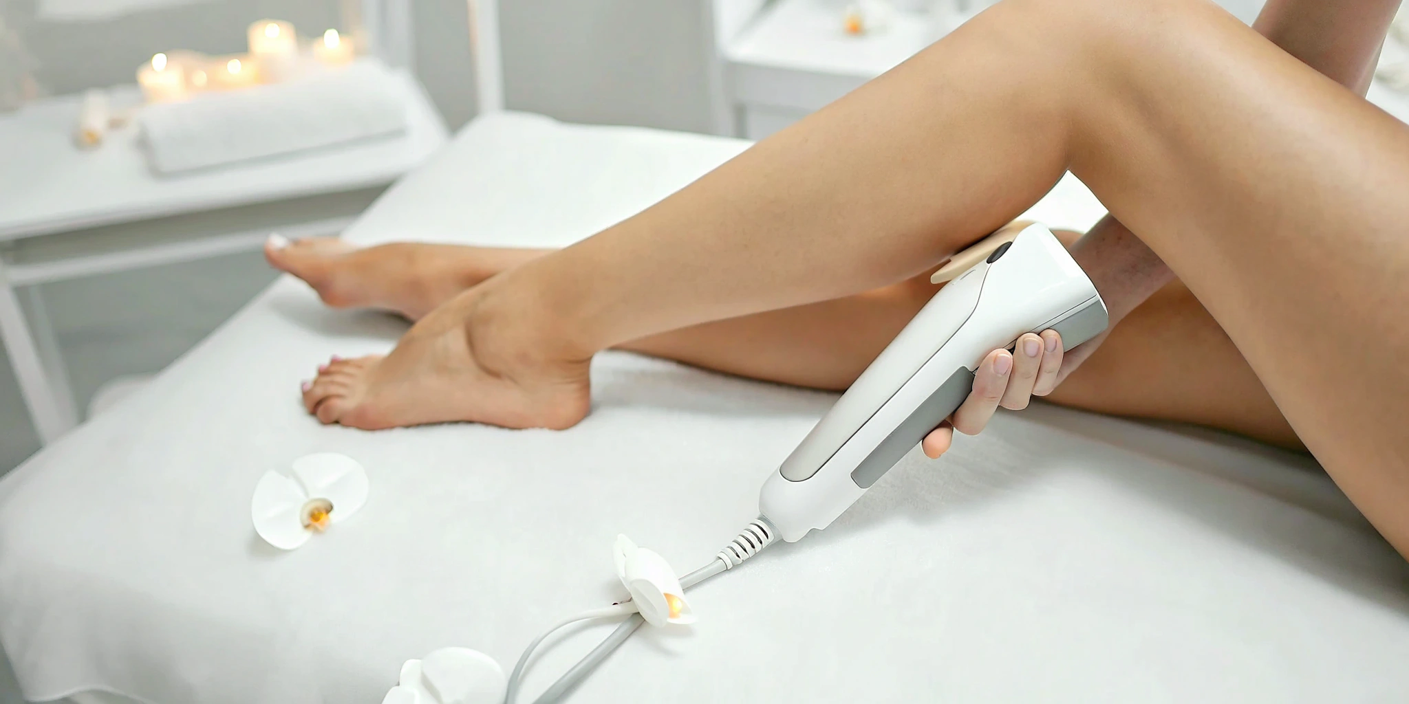 Woman receiving laser hair removal on her legs at a spa in Lewisville.