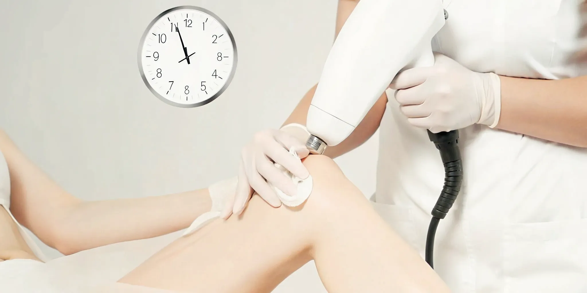 Clock showing how long to wait between laser tattoo removal sessions on a leg.