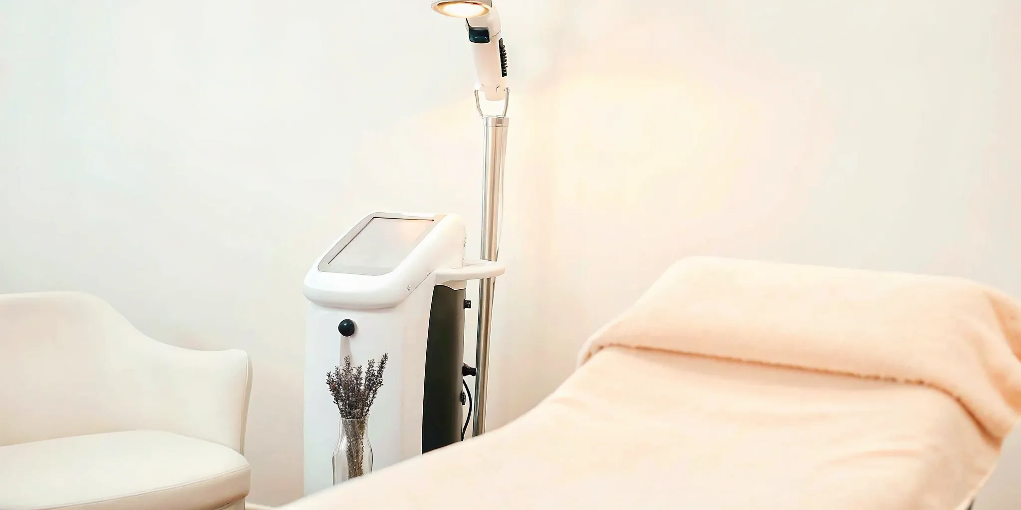 Laser hair removal machine in a treatment room.