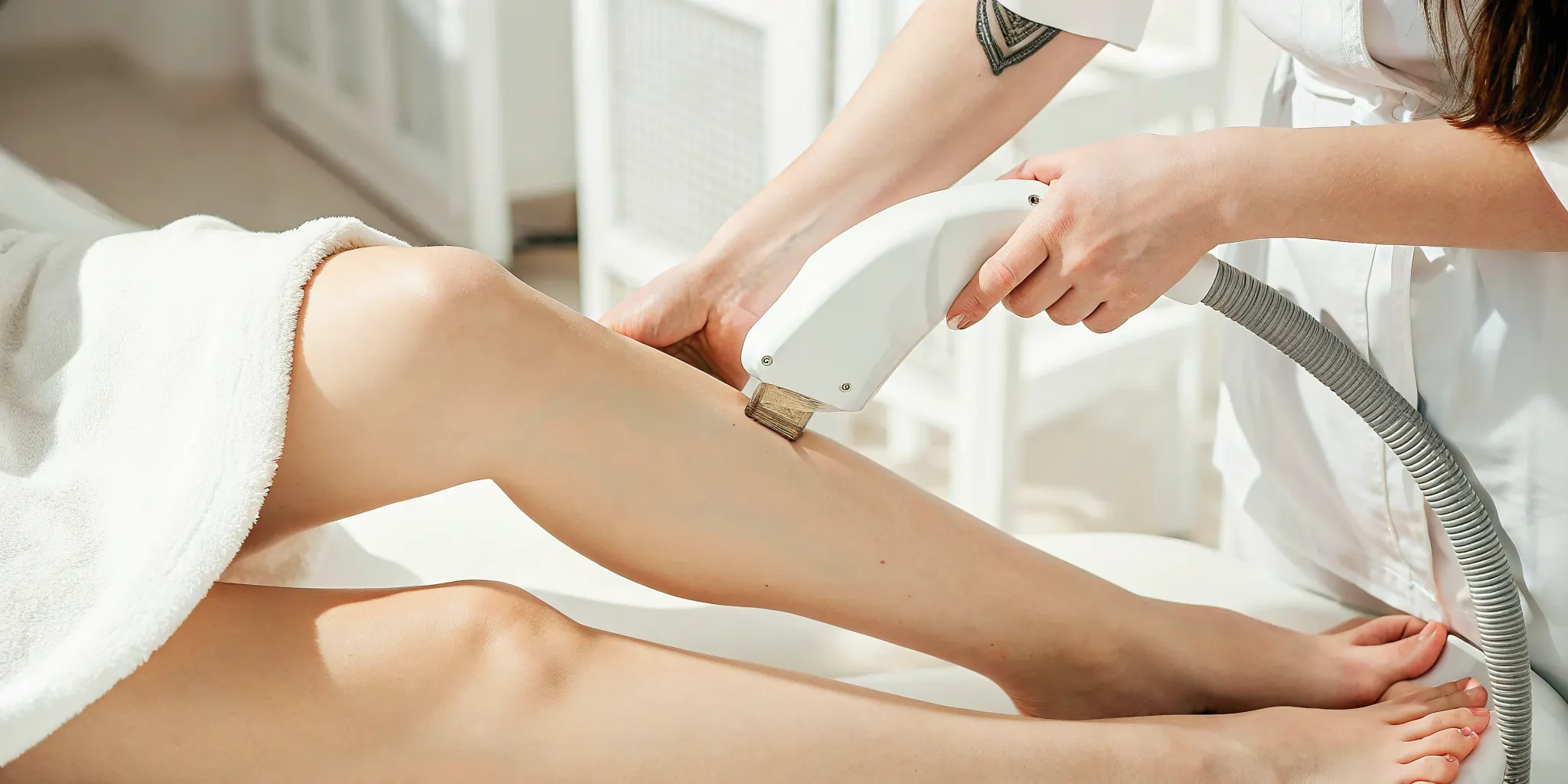 Laser tattoo removal on lower leg.