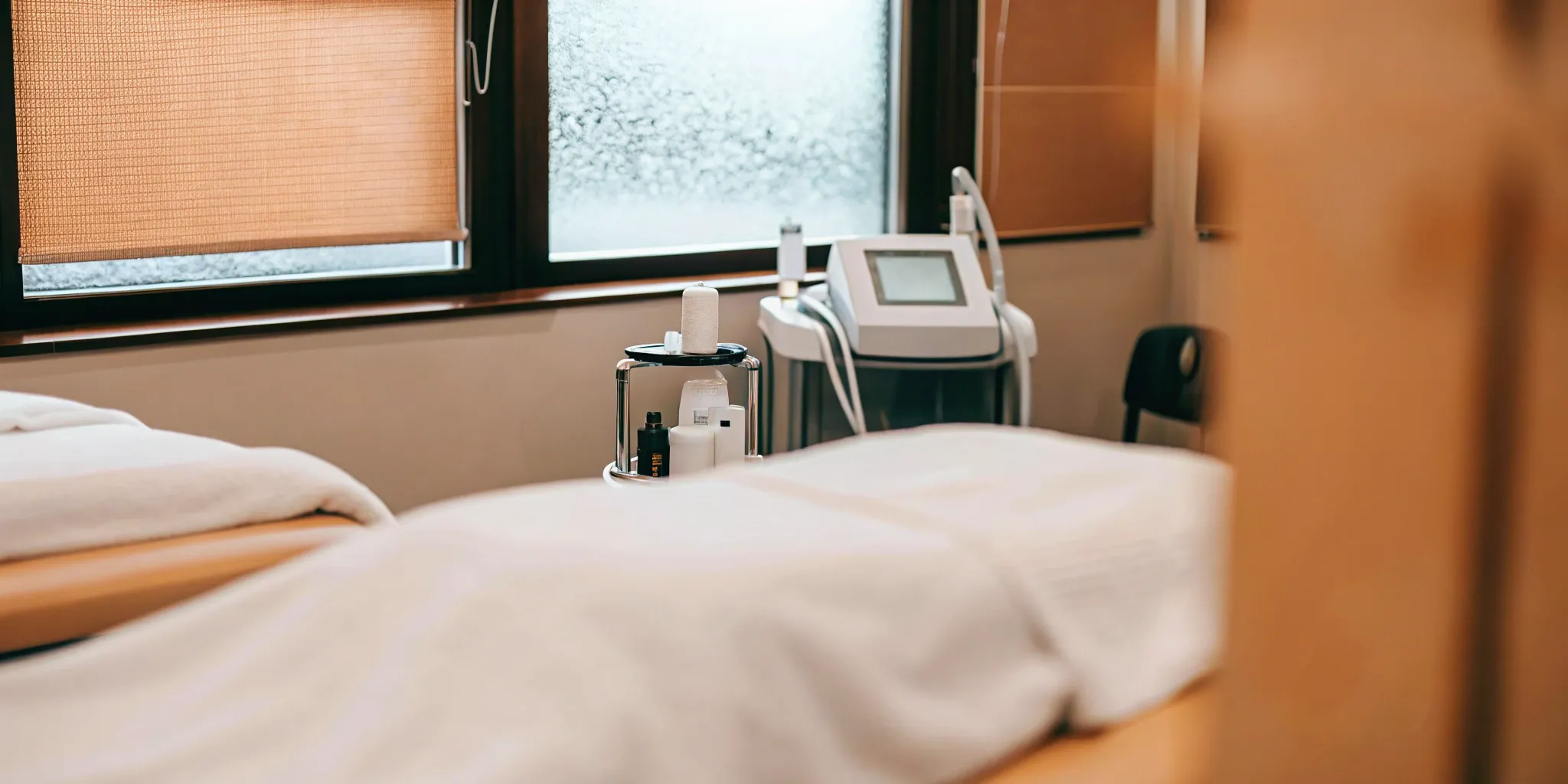 Advanced non-surgical body contouring equipment in a modern treatment room.