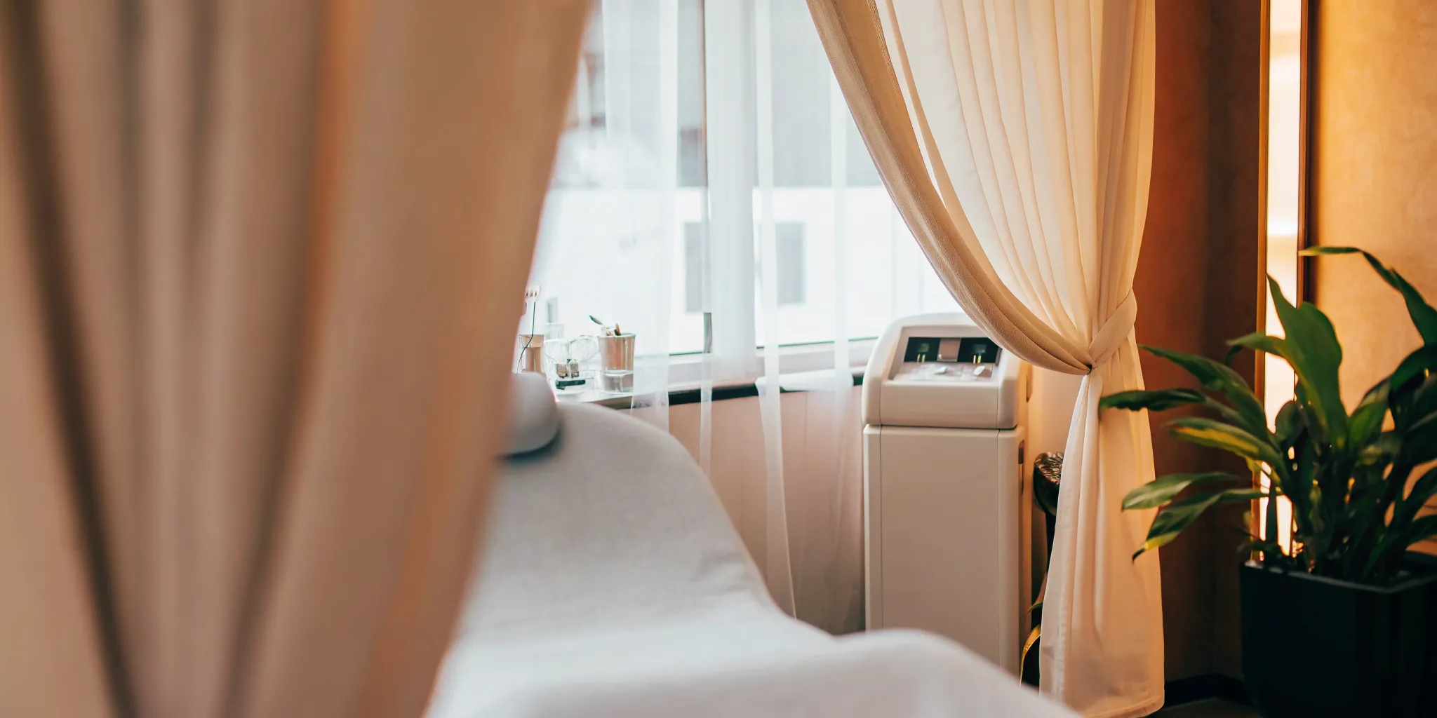 A clean, modern treatment room in an affordable medspa with high-quality equipment.