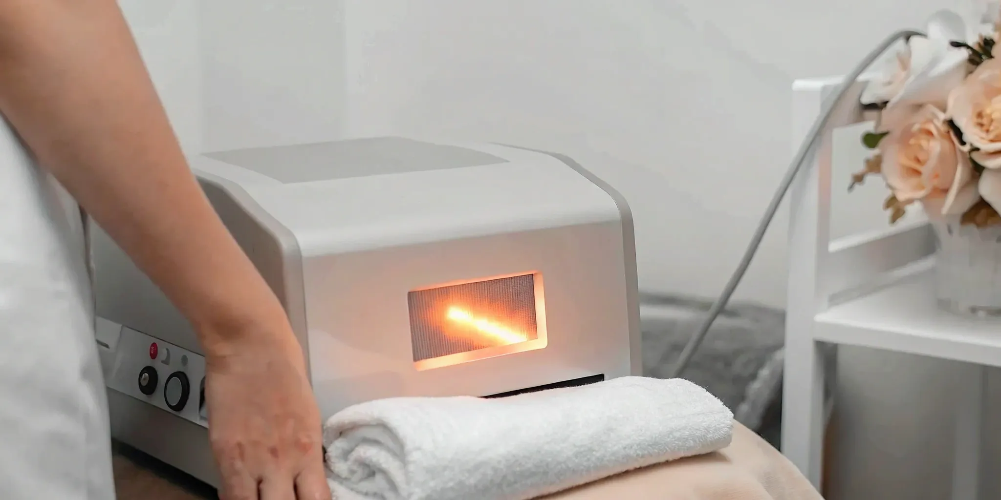 A laser hair removal machine in Dallas, showing the technology that affects the treatment cost.
