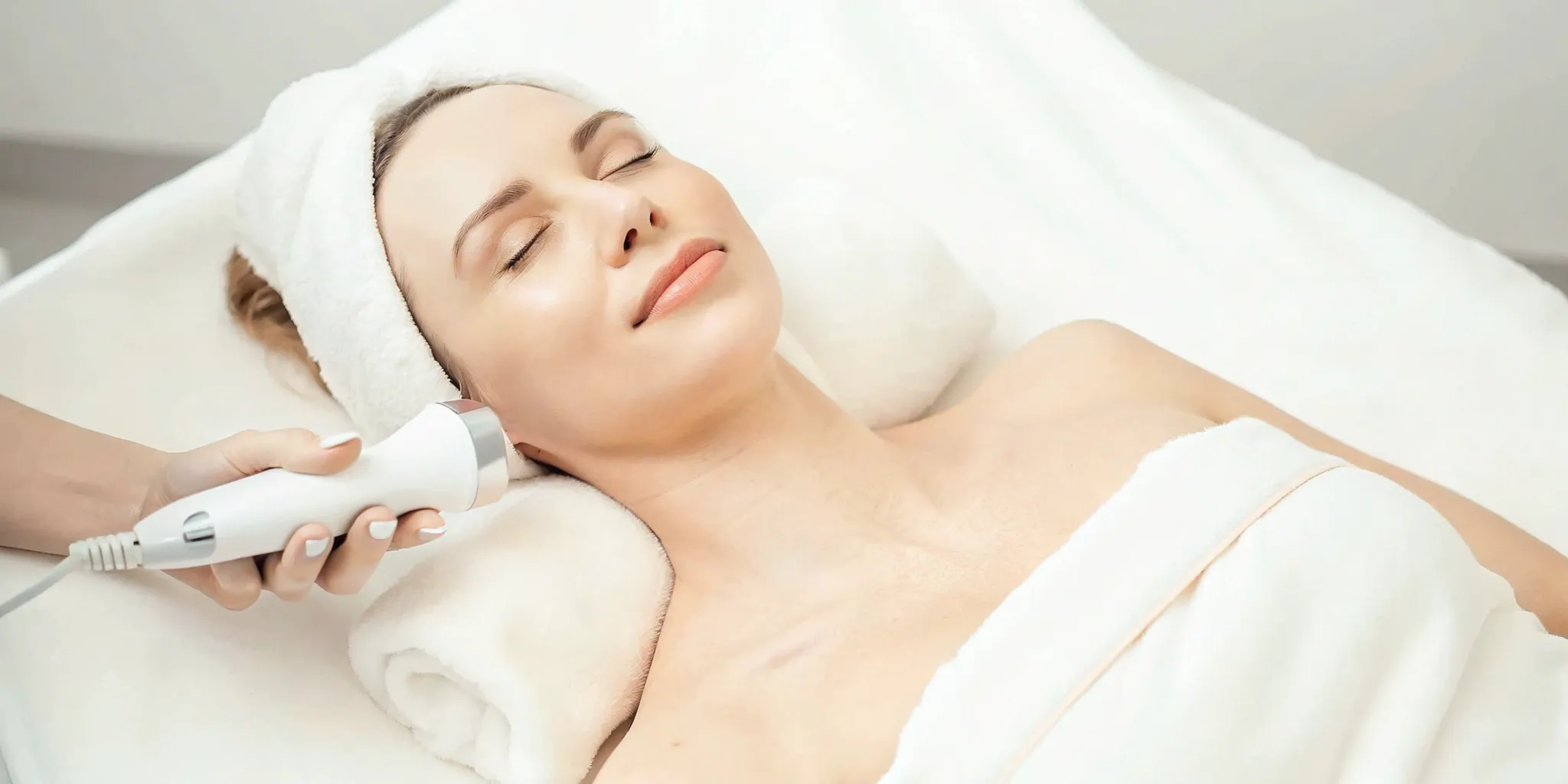Non-surgical skin tightening treatment for the face and neck with a handheld device.