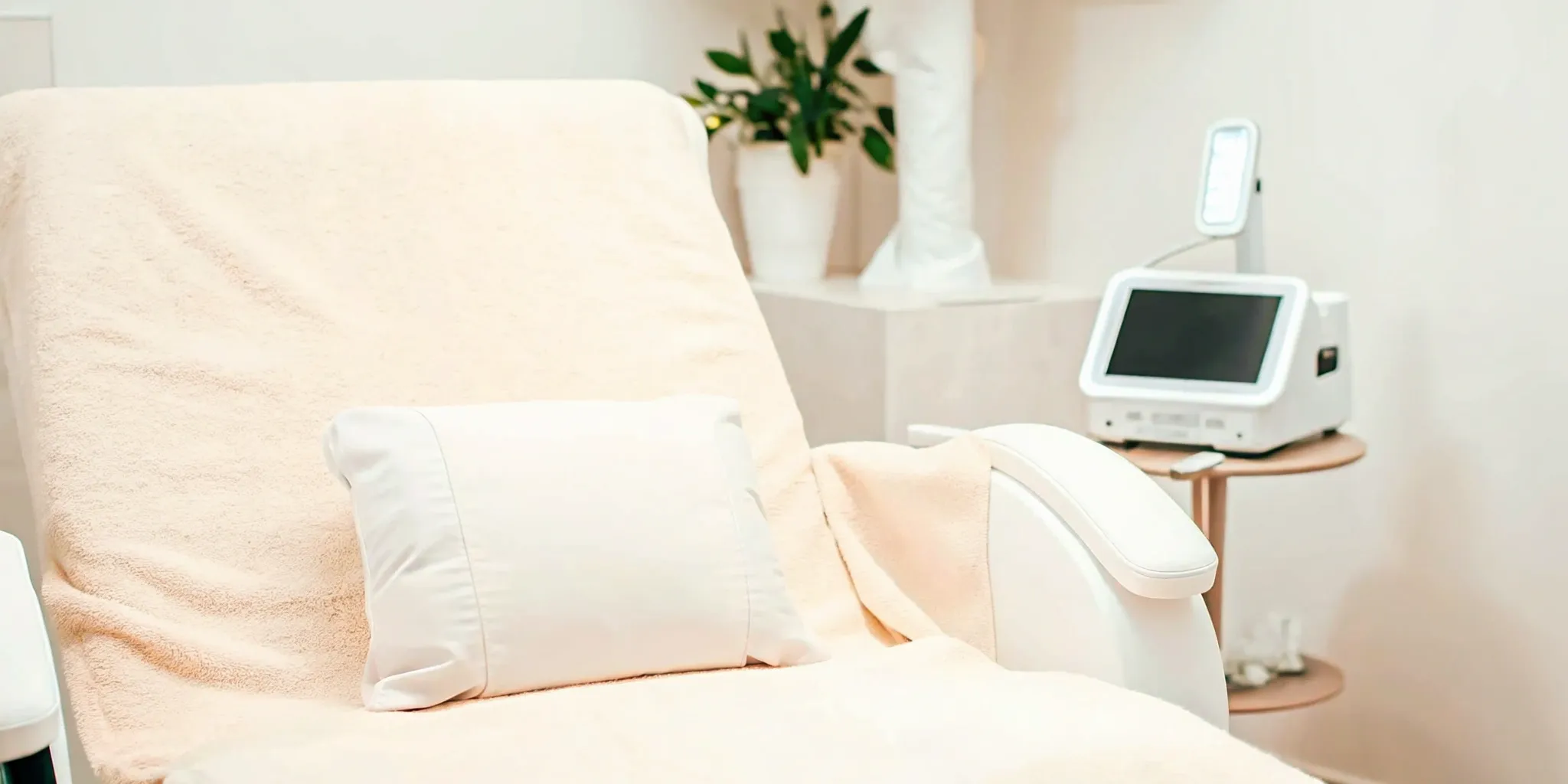 A modern clinic room with an IPL machine for a photofacial treatment near me.