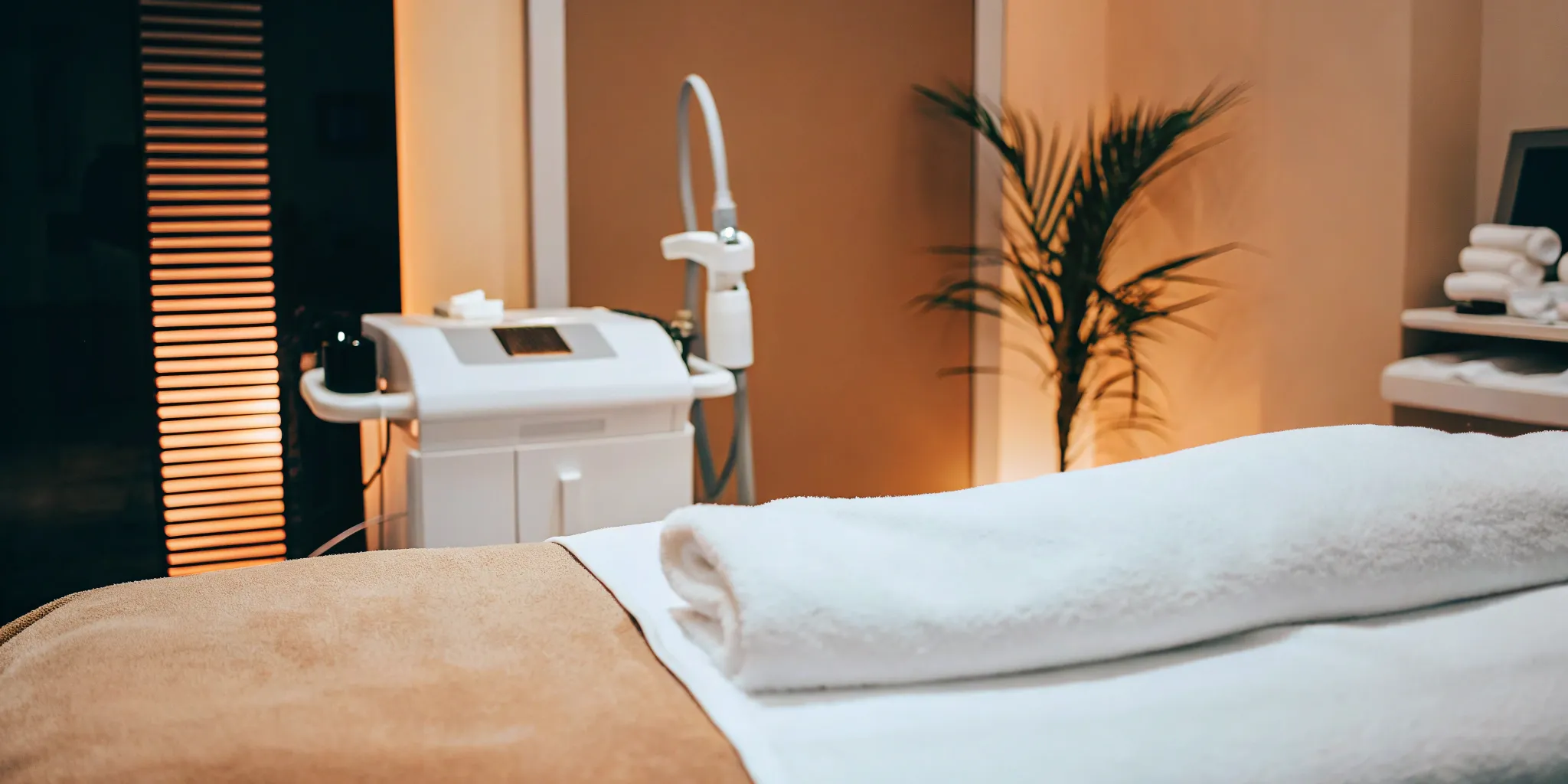 A professional treatment room with a laser machine for full body hair removal.