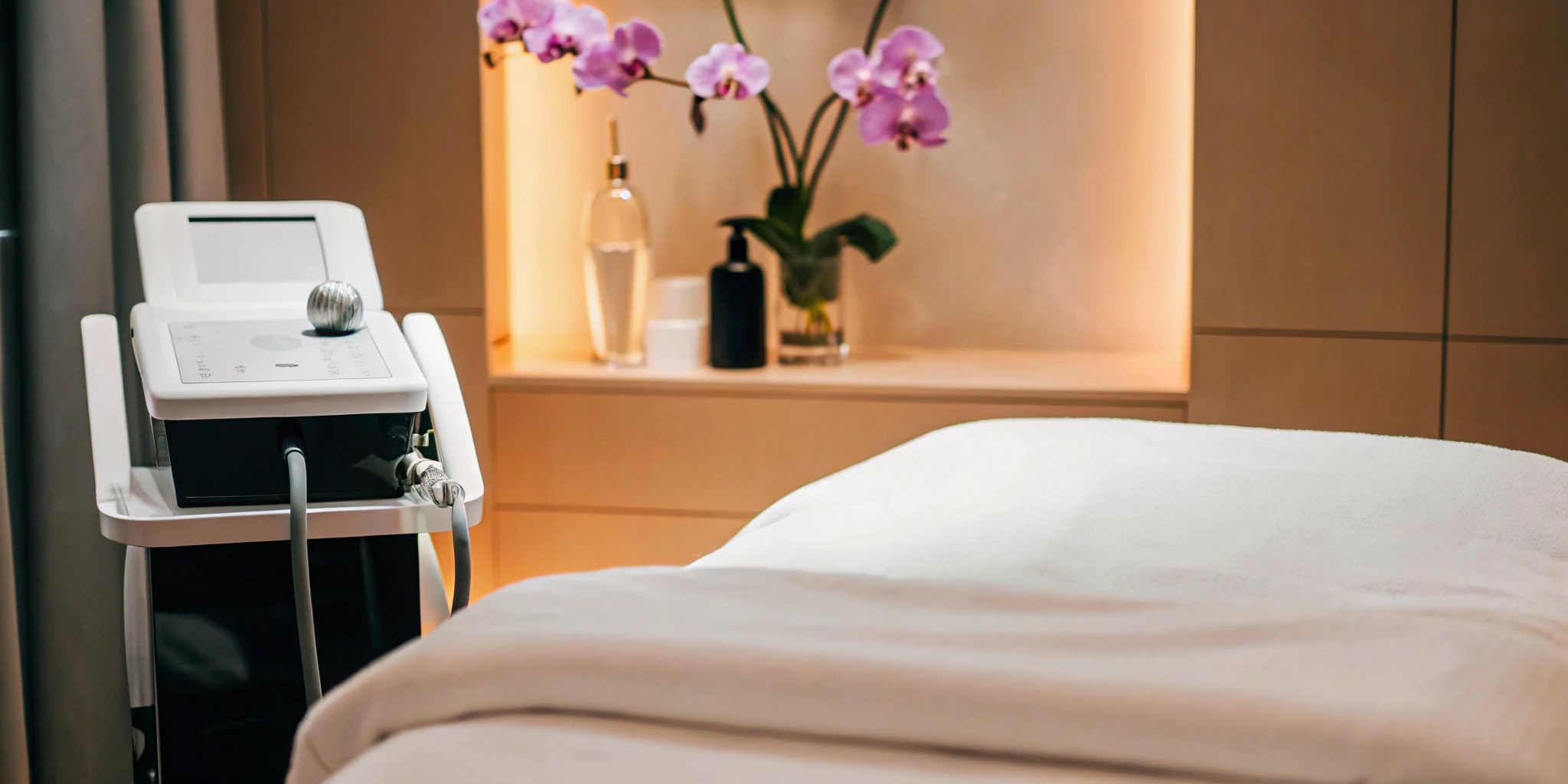 Hydrafacial machine and treatment bed in a professional medspa in Richardson.